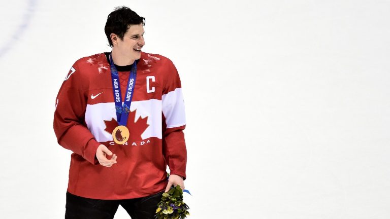 Canada captain Sidney Crosby smiles with his gold medal after Canada defeating Sweden during third period finals hockey action at the 2014 Sochi Winter Olympics in Sochi, Russia on Sunday, February 23, 2014 (Nathan Denette/CP).