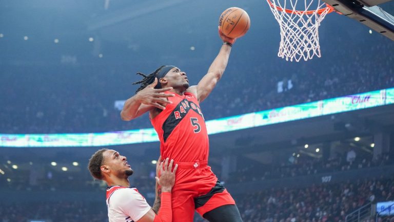 Toronto Raptors forward Precious Achiuwa (5) dunks past Washington Wizards centre Daniel Gafford (21) during first half NBA action in Toronto Wednesday, October 20, 2021. (Evan Buhler/CP)