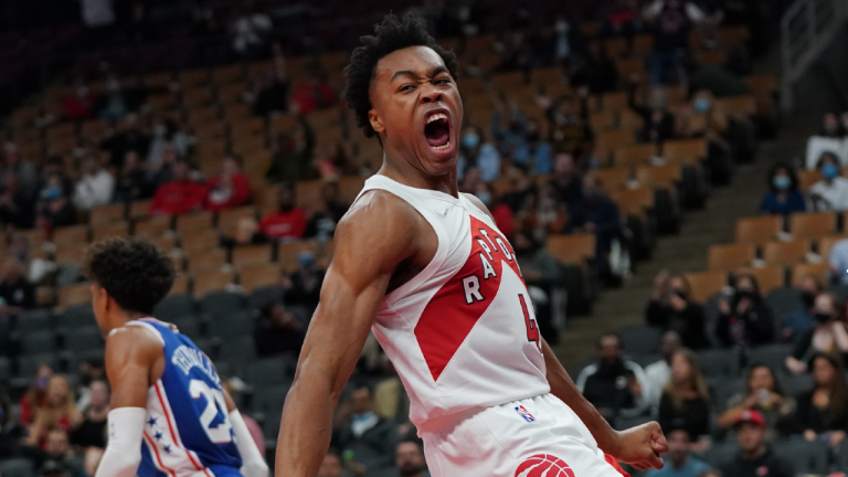 Toronto Raptors forward Scottie Barnes (4) reacts after a slam dunk against the Philadelphia 76ers during first half pre-season NBA basketball action in Toronto on Monday Oct. 4, 2021. (Nathan Denette/CP)