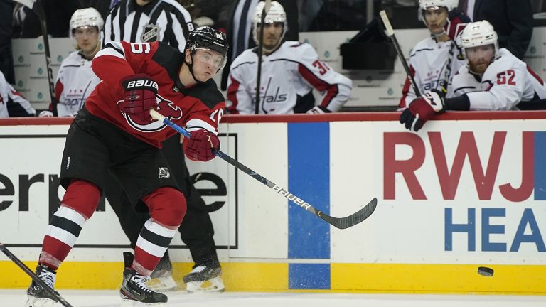 The Washington Capitals bench watches as New Jersey Devils' Jimmy Vesey (16) scores an empty net goal during the third period of an NHL preseason hockey game, Monday, Oct. 4, 2021, in Newark, N.J. (Frank Franklin II/AP)