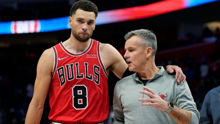 Chicago Bulls guard Zach LaVine (8) walks off the court with head coach Billy Donovan after the second half of an NBA basketball game (Carlos Osorio/AP).
