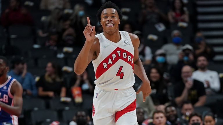 Toronto Raptors forward Scottie Barnes (4) reacts after a slam dunk past Philadelphia 76ers guard Shake Milton (18) during second half NBA pre-season basketball action in Toronto on Monday, Oct. 4, 2021. (Nathan Denette/CP)