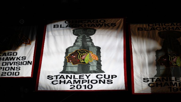 The 2010 Stanley Cup Championship banner is seen during a ceremony before the Chicago Blackhawks season home opening game against the Detroit Red Wings at the United Center on October 9, 2010 in Chicago, Illinois. (Photo by Jonathan Daniel/Getty Images)