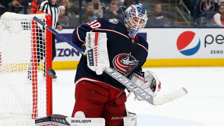 Columbus Blue Jackets' Elvis Merzlikins makes a save against the Dallas Stars during the third period of an NHL hockey game. (Jay LaPrete/AP) 