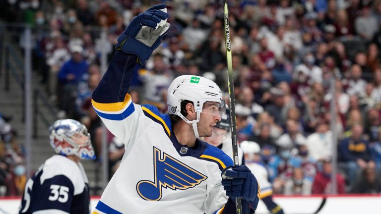 St. Louis Blues left wing Brandon Saad, front, celebrates after left wing David Perron scored a goal past Colorado Avalanche goaltender Darcy Kuemper, back, in the second period of an NHL hockey game. (David Zalubowski/AP) 