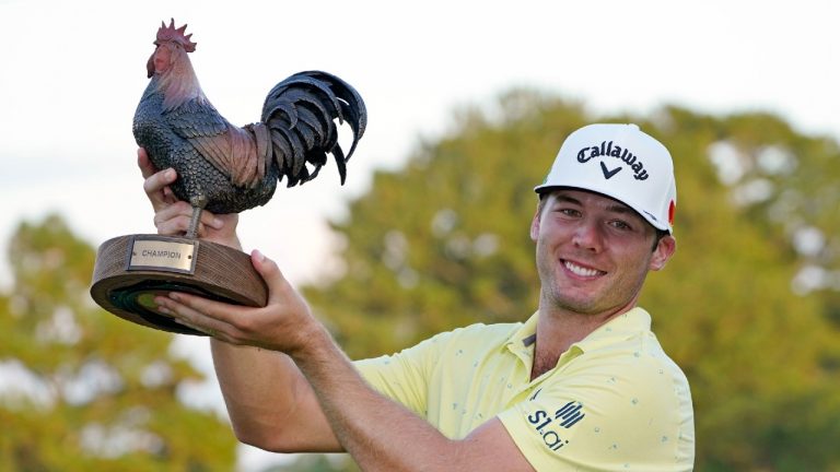 Sam Burns holds the champion's trophy after winning the Sanderson Farms Championship golf tournament in Jackson, Miss., Sunday, Oct. 3, 2021. (Rogelio V. Solis/AP)