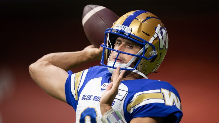 Winnipeg Blue Bombers quarterback Zach Collaros warms up before a CFL football game against the B.C. Lions in Vancouver, on Friday, October 1, 2021. (Darryl Dyck/CP)