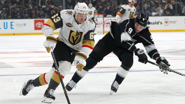 Vegas Golden Knights forward Evgenii Dadonov (63) drives the puck away from Los Angeles Kings forward Adrian Kempe (9) during the first period of an NHL hockey game. (Ringo H.W. Chiu/AP) 