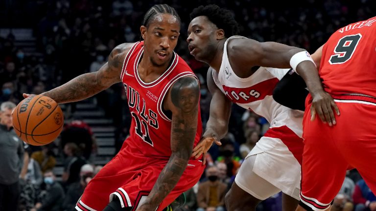 Chicago Bulls forward DeMar DeRozan (11) moves the ball around Toronto Raptors forward OG Anunoby (3) during first half NBA basketball action in Toronto, Monday, Oct. 25, 2021. (Nathan Denette/CP) 