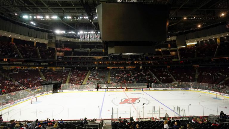 Fans wait for an NHL preseason hockey game between the New Jersey Devils and the New York Islanders. The game was delayed due to a power outage at the Prudential Center. (Frank Franklin II/AP) 