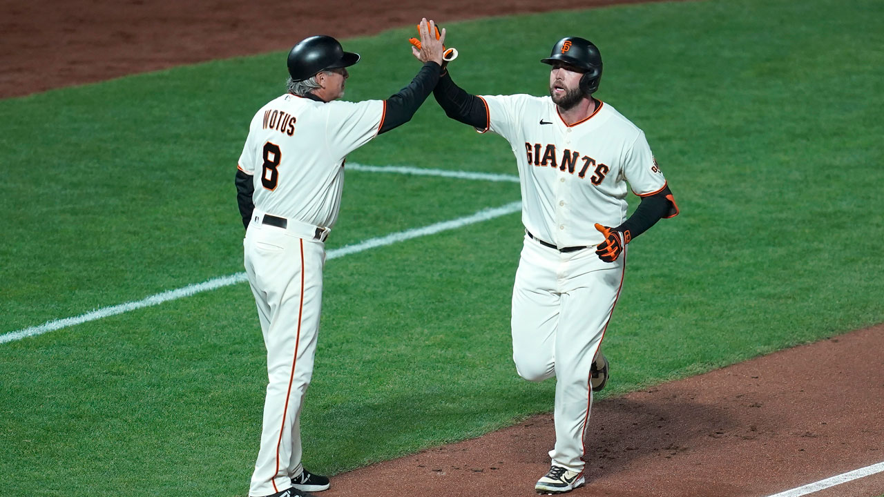 San Francisco Giants' J.D. Davis, right, is congratulated by