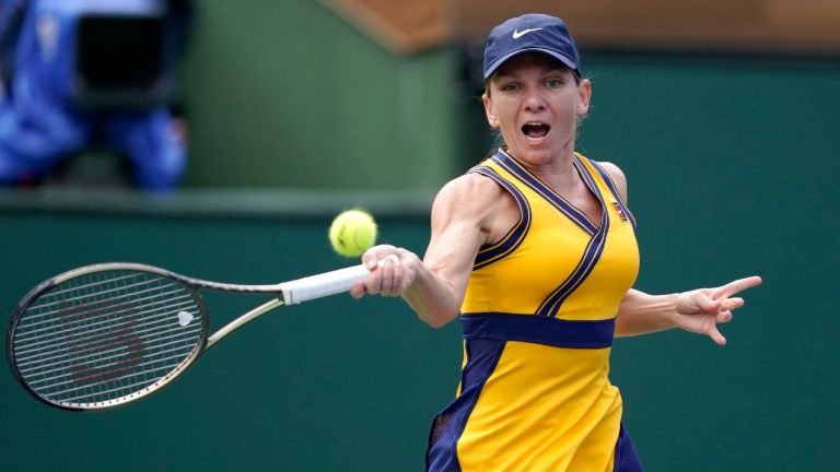 Simona Halep, of Romania, returns to Marta Kostyuk, of Ukraine, at the BNP Paribas Open tennis tournament Friday, Oct. 8, 2021, in Indian Wells, Calif. (Mark J. Terrill/AP)