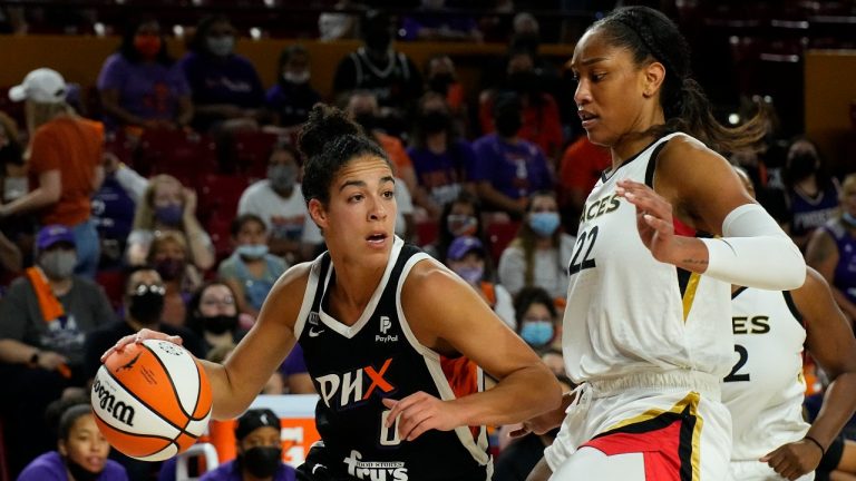 Phoenix Mercury guard Kia Nurse (0) drives on Las Vegas Aces forward A'ja Wilson during the first half of a WNBA basketball game Sunday, Oct. 3, 2021, in Phoenix. (Rick Scuteri/AP Photo) 
