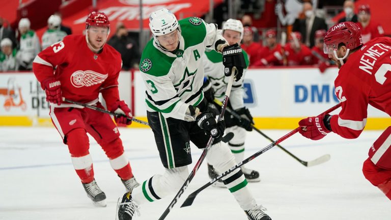 Dallas Stars defenseman John Klingberg (3) takes a slap shot as Detroit Red Wings defenseman Patrik Nemeth (22) defends during the first period of an NHL hockey game. (Carlos Osorio/AP) 