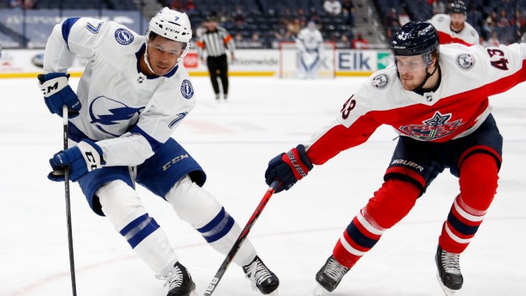 Tampa Bay Lightning forward Mathieu Joseph, left, controls the puck against Columbus Blue Jackets defenceman Mikko Lehtonen during the first period of an NHL hockey game in Columbus, Ohio, Tuesday, April 6, 2021. (Paul Vernon/AP)