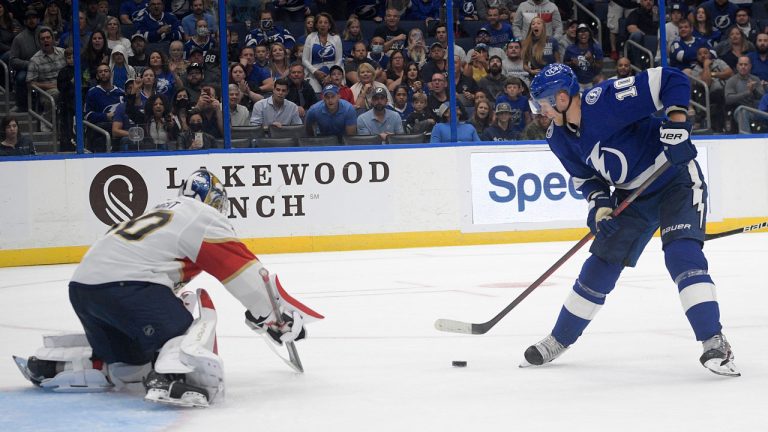 Tampa Bay Lightning right wing Corey Perry (10) sets up for a score past Florida Panthers goaltender Spencer Knight, left, during the second period of a preseason NHL hockey game. (Phelan M. Ebenhack/AP) 