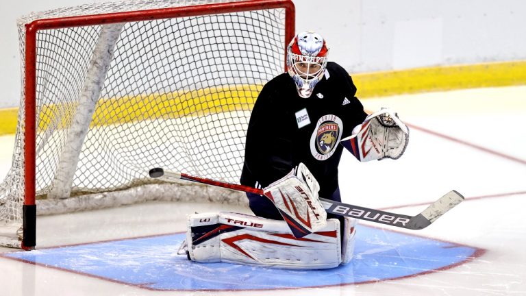 Goalie Sam Montembeault blocks a shot during an NHL hockey training camp with the Florida Panthers Thursday, Sept. 23, 2021, in Sunrise, Fla. (David Santiago/Miami Herald via AP) 
