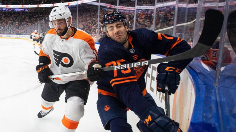 Philadelphia Flyers' Derick Brassard (19) checks Edmonton Oilers' Evan Bouchard (75) during first period NHL action in Edmonton on Wednesday, October 27, 2021. (Jason Franson/THE CANADIAN PRESS) 
