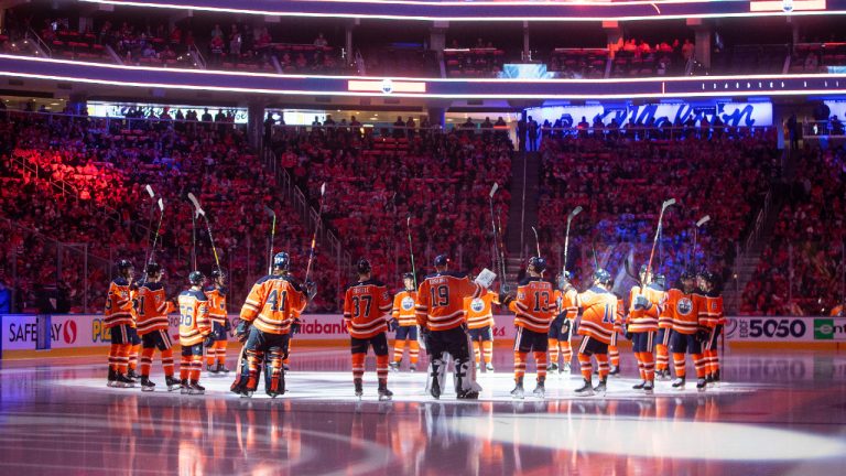 Edmonton Oilers gather before the team's NHL hockey game against the Vancouver Canucks on Wednesday, Oct. 13, 2021, in Edmonton, Alberta. (Jason Franson/The Canadian Press via AP) 