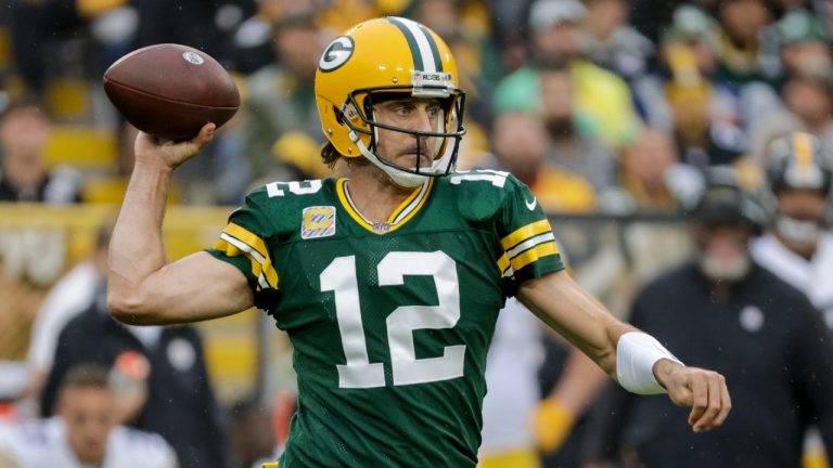 Green Bay Packers' Aaron Rodgers throws during the first half of an NFL football game against the Pittsburgh Steelers. (Mike Roemer/AP)