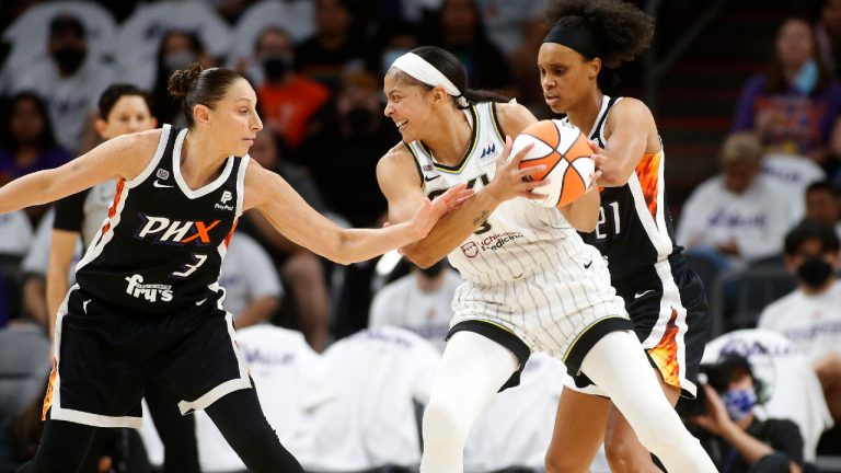 Chicago Sky forward/center Candace Parker looks to pass as Phoenix Mercury guard Diana Taurasi (3) defends during the first half of game 1 of the WNBA basketball Finals.(Ralph Freso/AP) 