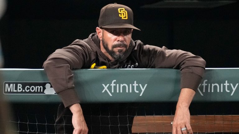 San Diego Padres manager Jayce Tingler leans over the dugout rail during the seventh inning of the team's baseball game against the Colorado Rockies on Tuesday, Aug. 17, 2021, in Denver. (David Zalubowski/AP)