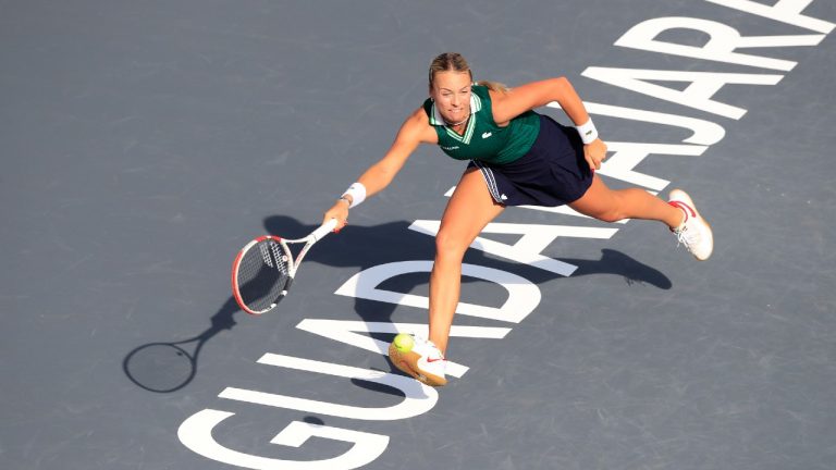 Anett Kontaveit of Estonia returns a shot to Czech Republic's Barbora Krejcikova during a match of the Mexican Tennis WTA Finals in Guadalajara, Mexico, Wednesday, Nov. 10, 2021. (AP)