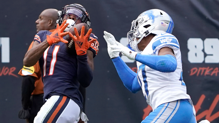 Chicago Bears wide receiver Darnell Mooney (11) catches a pass from quarterback Justin Fields as Detroit Lions defensive back Bobby Price defends during the second half on Sunday, Oct. 3, 2021, in Chicago. (AP) 