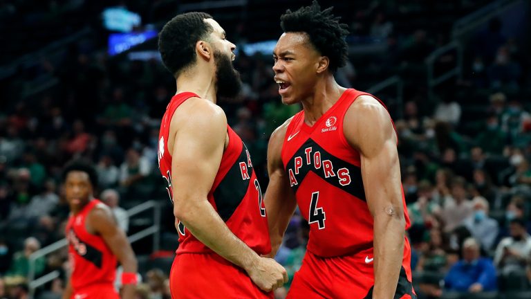 Toronto Raptors' Scottie Barnes (4) reacts with teammate Fred VanVleet after scoring during the second half of an NBA basketball game against the Boston Celtics, Friday, Oct. 22, 2021, in Boston. (Michael Dwyer/AP)