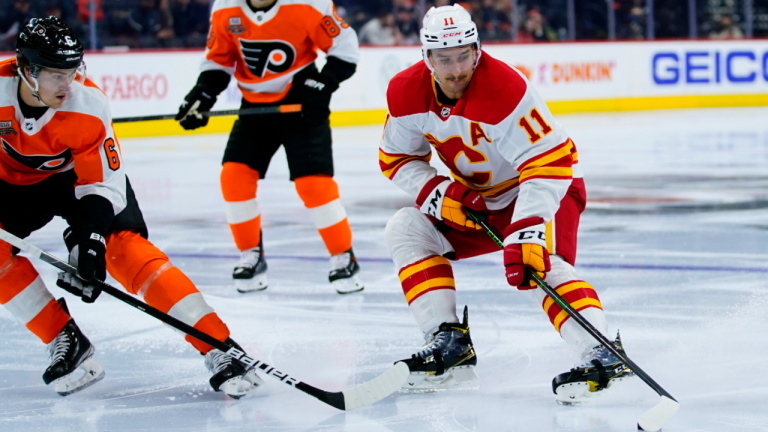 Calgary Flames forward Mikael Backlund skates with the puck. (AP)