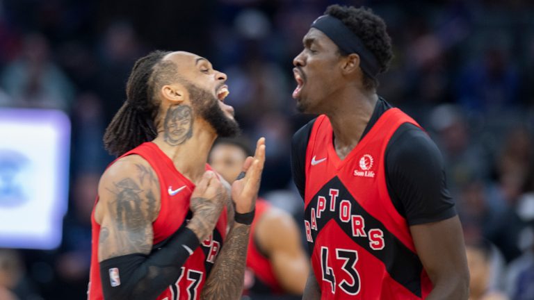 Toronto Raptors guard Gary Trent Jr. (33) and forward Pascal Siakam (43) celebrate after Siakam's 3-point basket against the Sacramento Kings during the second half of an NBA basketball game in Sacramento, Calif., Friday, Nov. 19, 2021. (Jose Luis Villegas/AP)