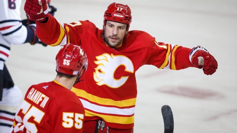 Calgary Flames' Milan Lucic, right, celebrates his goal with teammate Noah Hanifin during first period NHL hockey action against the Chicago Blackhawks in Calgary, Alta., Tuesday, Nov. 23, 2021. (Jeff McIntosh/CP)