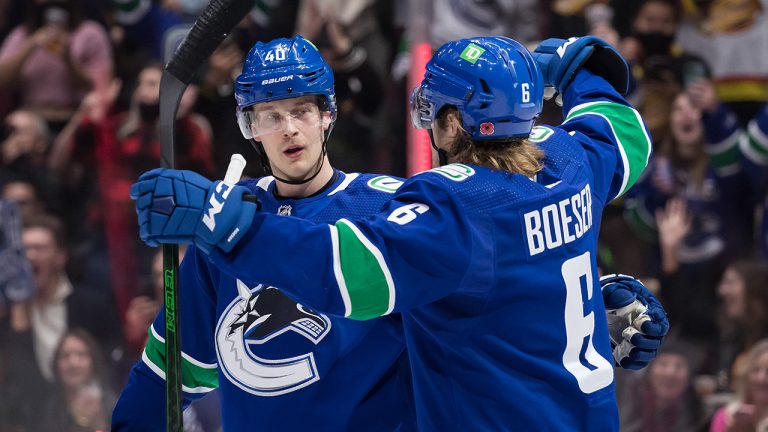 Vancouver Canucks' Elias Pettersson, left, of Sweden, and Brock Boeser celebrate Pettersson's goal against the Dallas Stars during the second period of an NHL hockey game. (Darryl Dyck/CP)