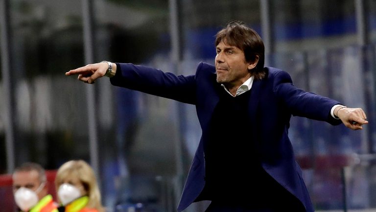 Former Inter Milan head coach Antonio Conte gives instructions to his players during a Serie A soccer match between Inter Milan and Roma at the San Siro stadium in Milan, Italy, Wednesday, May 12, 2021. (AP Photo/Luca Bruno) 
