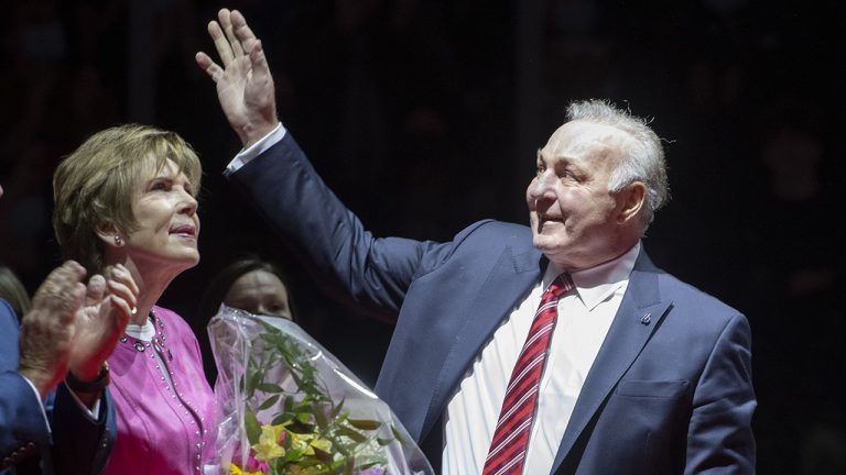 NHL hockey legend Guy Lafleur waves to the Remparts fans as his wife Lise looks on during a ceremony to honour him. (Jacques Boissinot/THE CANADIAN PRESS)