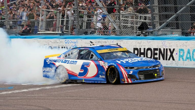 Kyle Larson celebrates after winning a NASCAR Cup Series auto race and championship on Sunday, Nov. 7, 2021, in Avondale, Ariz. (Rick Scuteri/AP)