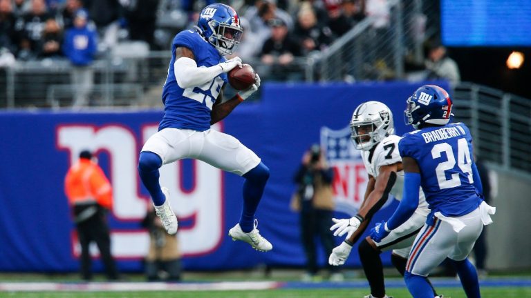 New York Giants free safety Xavier McKinney (29) intercepts a pass intended for Las Vegas Raiders' Zay Jones (7) as Giants' James Bradberry (24) watches during the second half of an NFL football game Sunday, Nov. 7, 2021, in East Rutherford, N.J. (John Munson/AP)