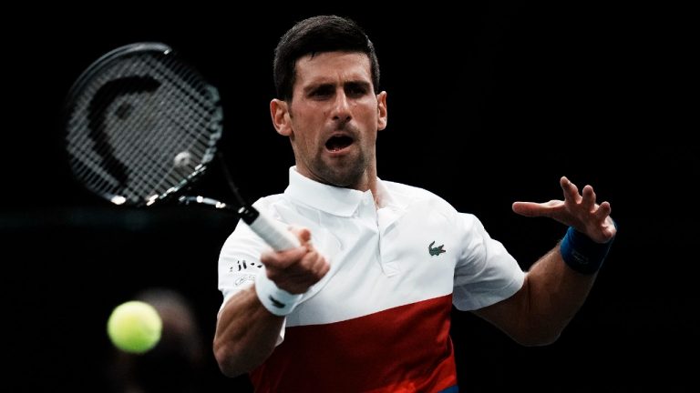 Serbia's Novak Djokovic plays a return to Hungary's Marton Fucsovics at the Paris Masters tennis tournament at the Bercy Arena in Paris, Tuesday, Nov. 2, 2021 (Thibault Camus/AP). 