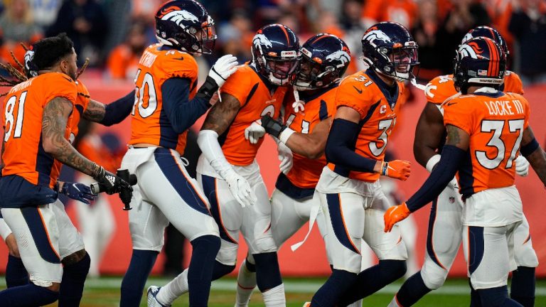 Denver Broncos cornerback Pat Surtain II (2) celebrates his interception with teammates during the second half of an NFL football game against the Los Angeles Chargers, Sunday, Nov. 28, 2021, in Denver (Jack Dempsey/AP).