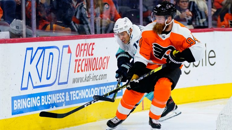 Seattle Kraken's Jaden Schwartz, left, and Philadelphia Flyers' Ryan Ellis battle for the puck during the third period of an NHL hockey game, Monday, Oct. 18, 2021, in Philadelphia. (Matt Slocum/AP)