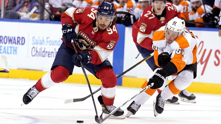 Florida Panthers left wing Ryan Lomberg (94) skates with the puck as Philadelphia Flyers defenseman Justin Braun (61) defends during the second period of an NHL hockey game. (Lynne Sladky/AP Photo)