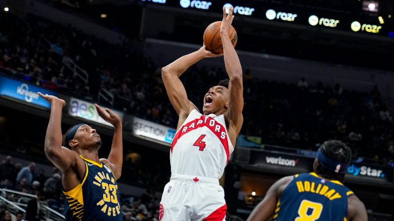 Toronto Raptors forward Scottie Barnes (4) shoots over Indiana Pacers center Myles Turner (33) during the first half of an NBA basketball game in Indianapolis, Saturday, Oct. 30, 2021 (Michael Conroy/AP).