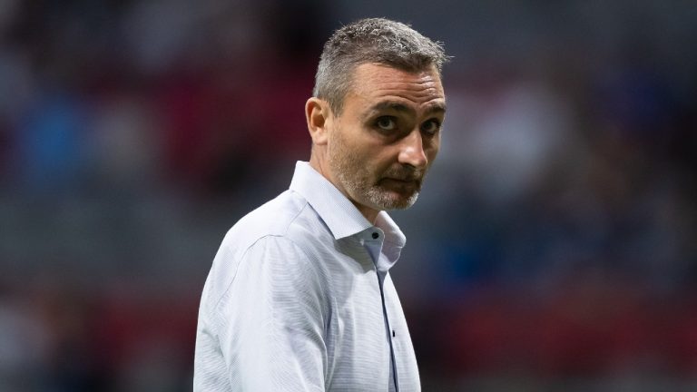 Vancouver Whitecaps acting head coach Vanni Sartini leaves the field at halftime during an MLS soccer match against Real Salt Lake, in Vancouver, B.C., Sunday, Aug. 29, 2021. (Darryl Dyck/CP) 
