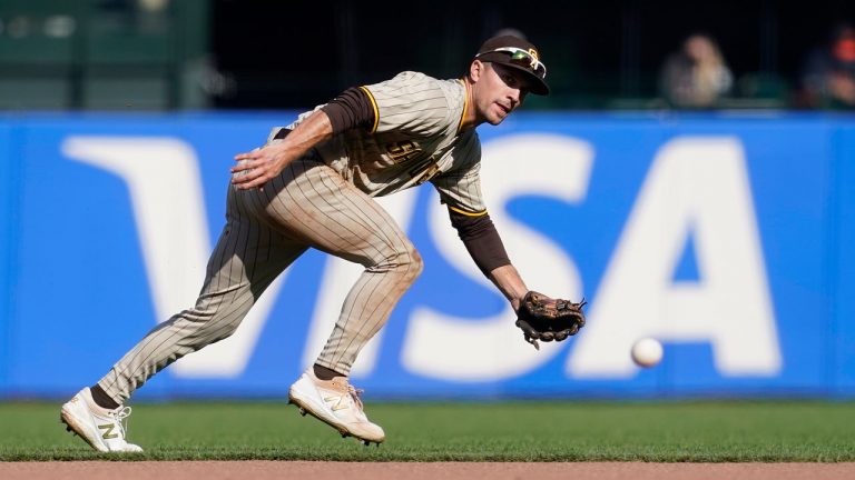 San Diego Padres second baseman Adam Frazier field the ball during a baseball game against the San Francisco Giants in San Francisco, on Sept. 16, 2021. The Seattle Mariners acquired All-Star second baseman Adam Frazier.  (Jeff Chiu/AP) 