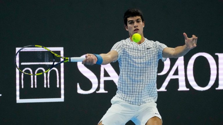 Spain's Carlos Alcaraz returns the ball to Denmark's Holger Vitus Nodskov Rune during the ATP Next Gen tennis tournament in Milan, Italy, Tuesday, Nov. 9, 2021. (Antonio Calanni/AP)