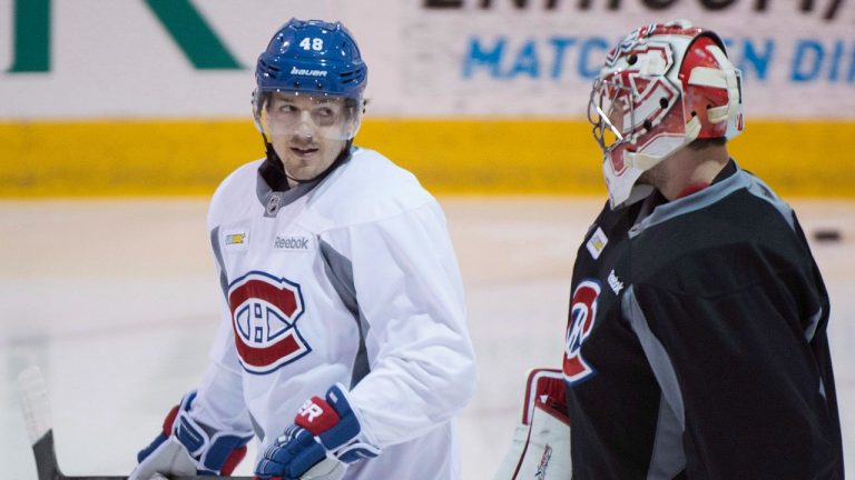 Former Montreal Canadiens forward Daniel Briere, left, chats with goaltender Carey Price during a practice session in Brossard, Que., Friday, April 25, 2014. The Canadiens will face either the Boston Bruins or the Detroit Red Wings in the second round of the NHL Stanley Cup playoffs. THE CANADIAN PRESS/Graham Hughes 
