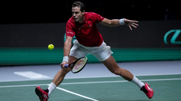 Canada's Vasek Pospisil returns the ball to Kazakhstan's Alexander Bublik during their Davis Cup tennis match at Madrid Arena. (Bernat Armangue/AP) 