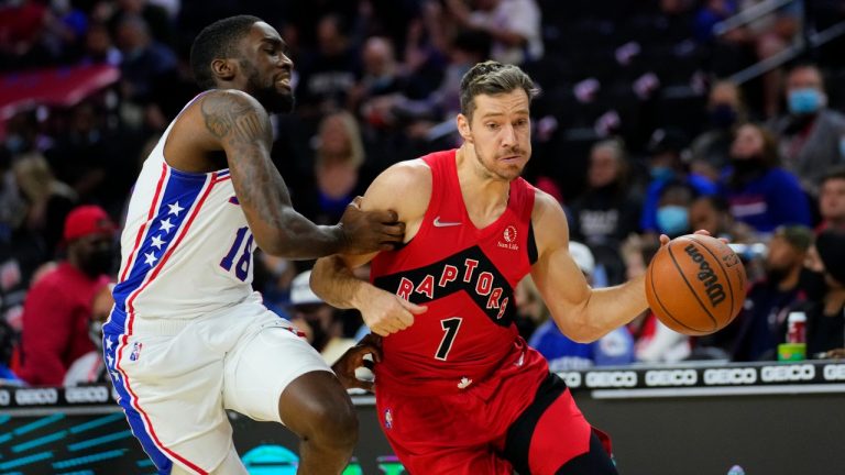 Toronto Raptors' Goran Dragic, right, tries to get past Philadelphia 76ers' Shake Milton during the first half of a preseason NBA basketball game, Thursday, Oct. 7, 2021, in Philadelphia. (Matt Slocum/AP Photo) 
