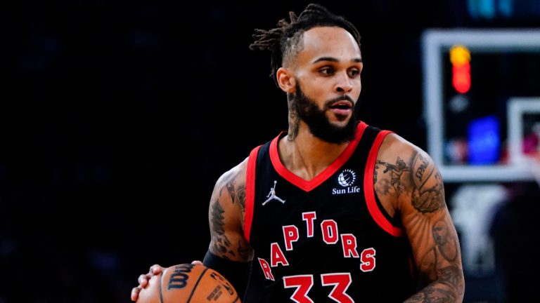 Toronto Raptors' Gary Trent Jr. (33) drives past New York Knicks' Evan Fournier (13) during the first half of an NBA basketball game Monday, Nov. 1, 2021, in New York. The Raptors won 113-104. (Frank Franklin II/AP) 