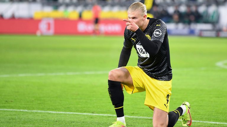 Dortmund's Erling Haaland celebrates after he scores his side third goal during the German Bundesliga soccer match between VfL Wolfsburg and Borussia Dortmund. (Swen Pfoertner/AP)